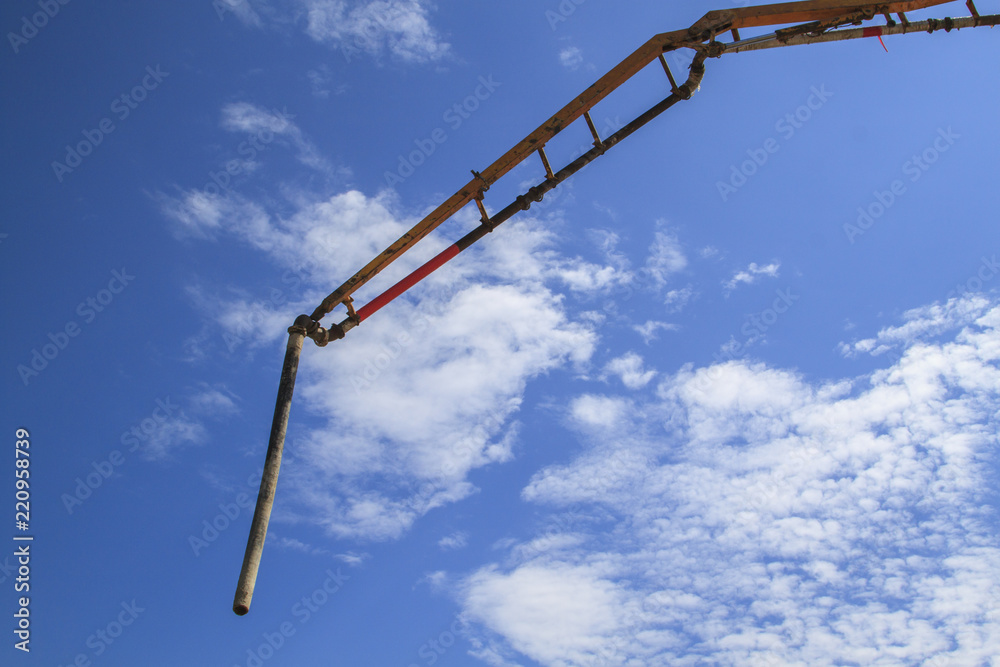 blue sky with white clouds and pipe of concrete pump blue sky with white clouds and pipe of concrete pump
