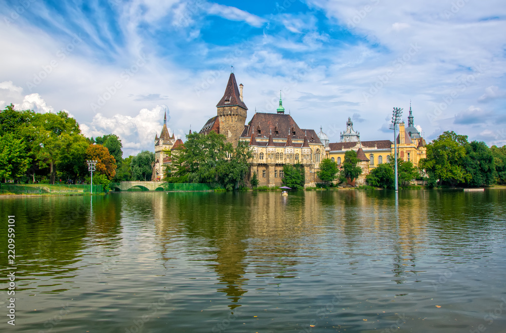 Scenic view of Vajdahunyad Castle reflected in the lake under the picturesque sky in main City Park, Budapest, Hungary
