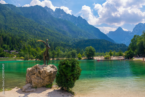 Scenic view of emerald water of Jasna lake near Kranjska Gora in Slovenia photo