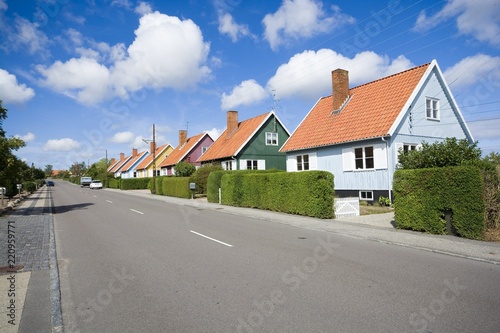 Traditional colorful wooden Swedish houses in the suburbs of Nexo, Bornholm, Denmark. The houses are the gift from Swedish state after the end of the Second World War.