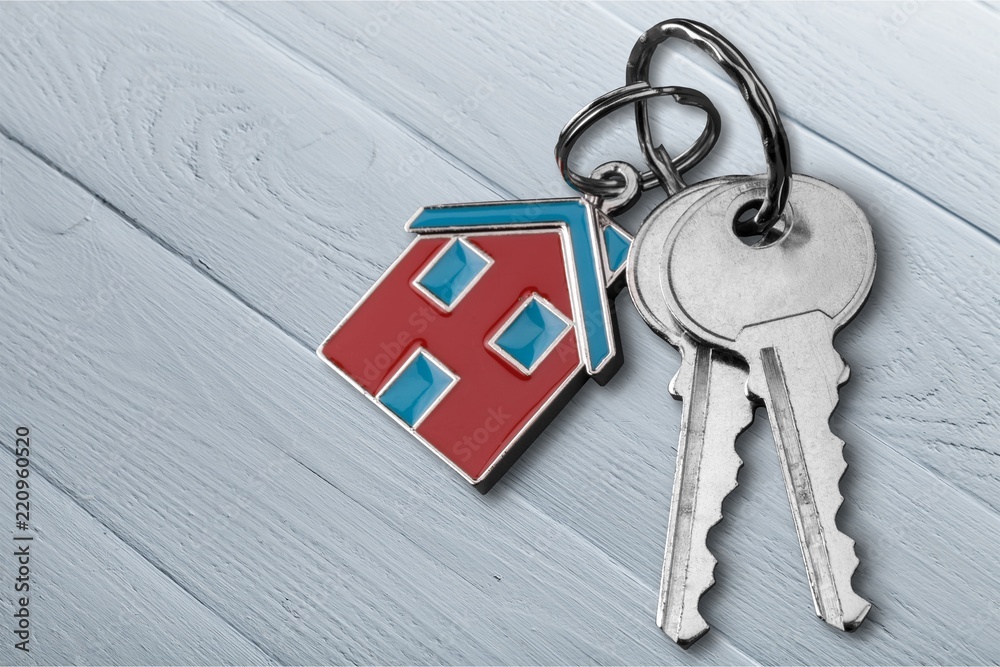 House keys with house figure on background Stock Photo | Adobe Stock