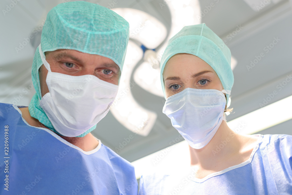 Male and female medical workers wearing masks Male and female medical workers wearing masks