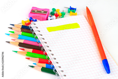 office supplies: notepad, pencils, and writing materials