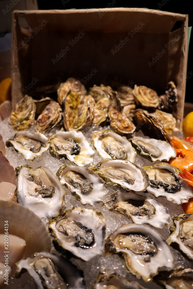 Tasty fresh oysters close-up on ice. Raw oysters are packed with nutrition, high in calcium, potassium, magnesium, vitamin and mineral. Flavor are sweet and refreshing. Believed to be an aphrodisiac. Tasty fresh oysters close-up on ice. Raw oysters are packed with nutrition, high in calcium, potassium, magnesium, vitamin and mineral. Flavor are sweet and refreshing. Believed to be an aphrodisiac.