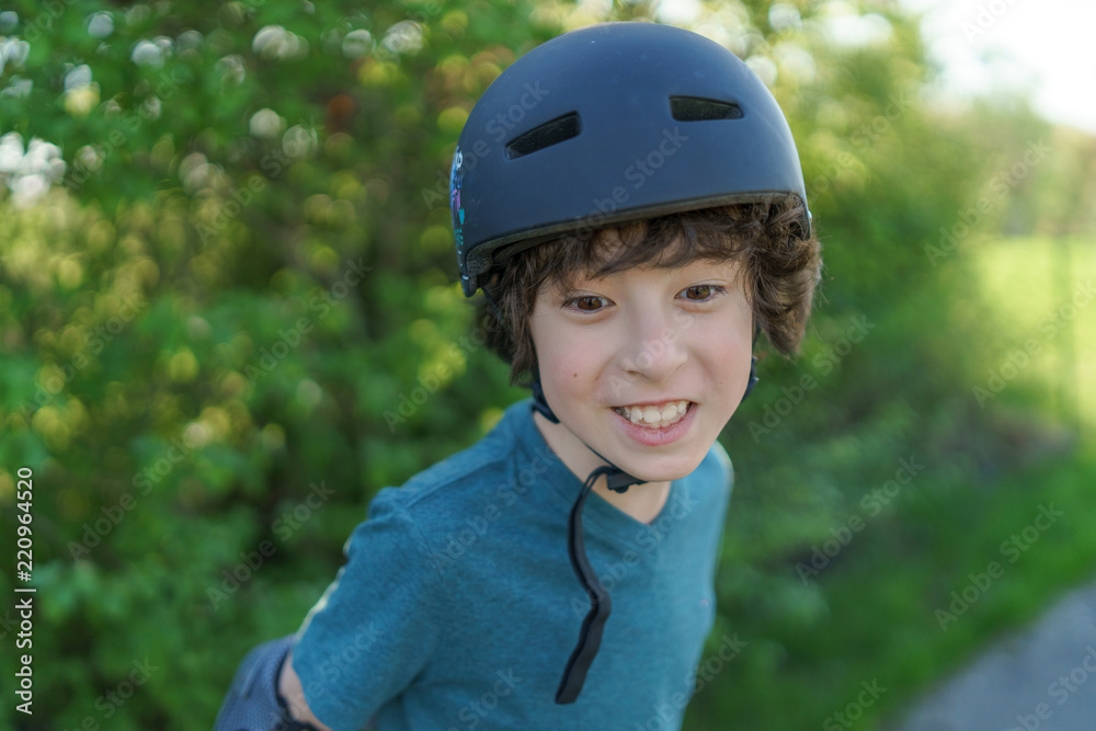 Portrait of a laughing boy in a protective helmet. Portrait of a laughing boy in a protective helmet.