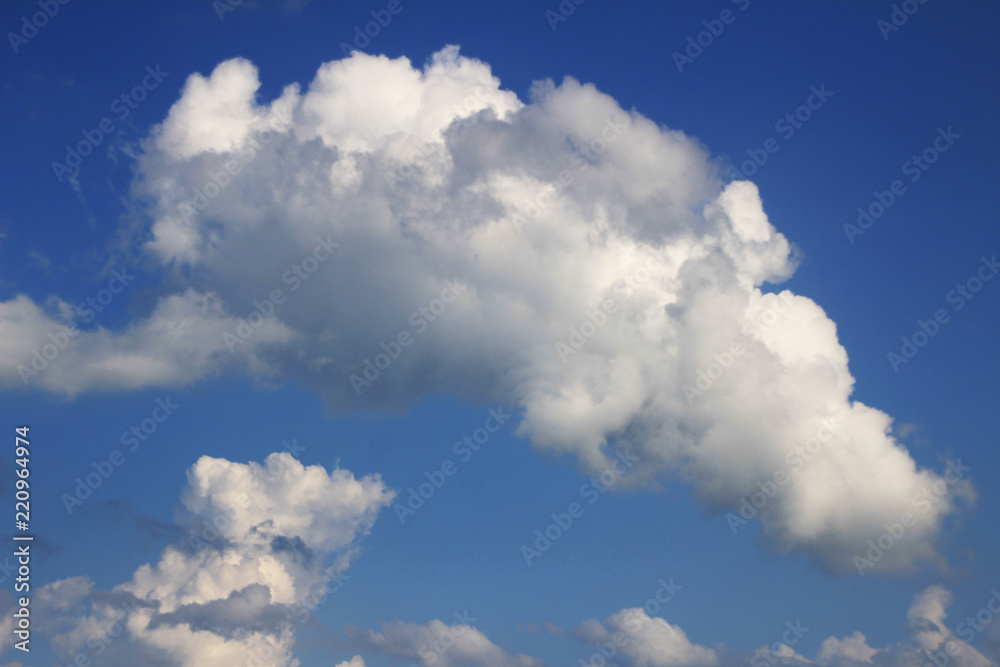 White of clouds on the sky in the blue day at summer under sunlight.Use for background or wallpaper. White of clouds on the sky in the blue day at summer under sunlight.Use for background or wallpaper.