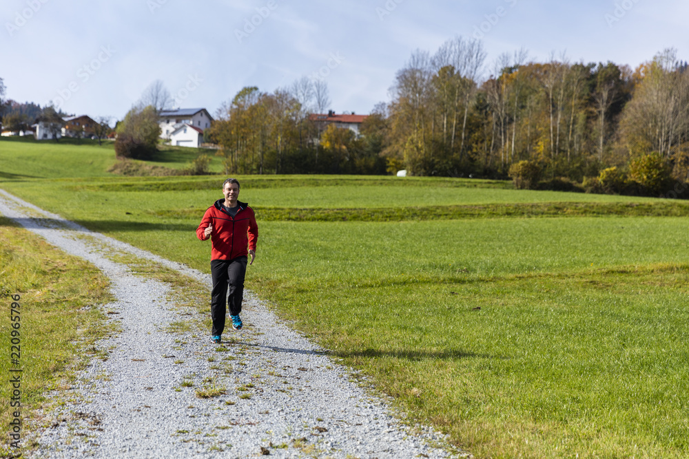 Fototapeta premium Male athlete working out in fresh air