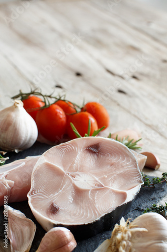 Two shark steak with vegetables and herbs photo