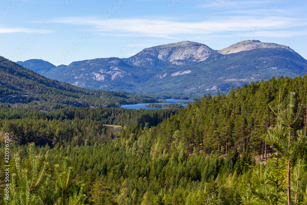 Wonderful landscape in Telemark region - mountain valley covered with the forest with blue lakes, Southern Norway