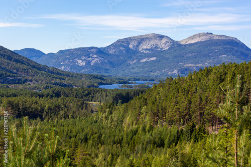 Wonderful landscape in Telemark region - mountain valley covered with the forest with blue lakes, Southern Norway