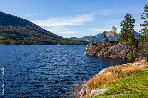 Wonderful landscape in Telemark region - fjord and stony coast covered with the forest, Southern Norway