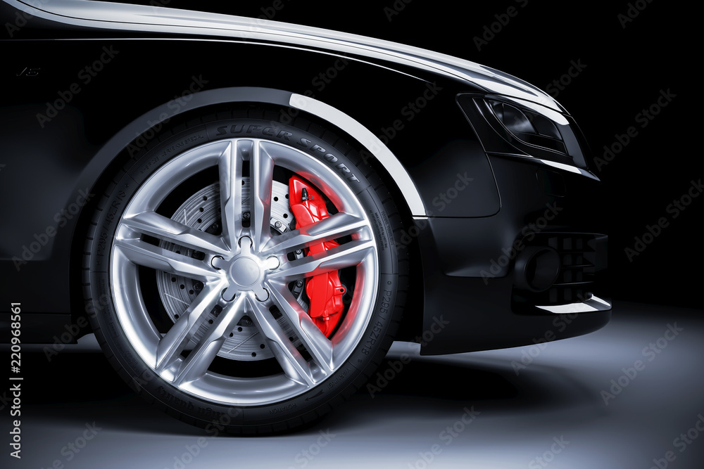 Sports car wheel with red brakes in studio lighting Sports car wheel with red brakes in studio lighting
