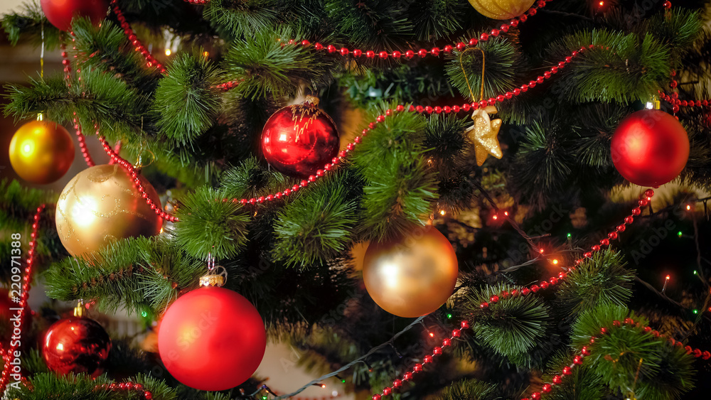 Closeup photo of Christmas tree with red and golden balls