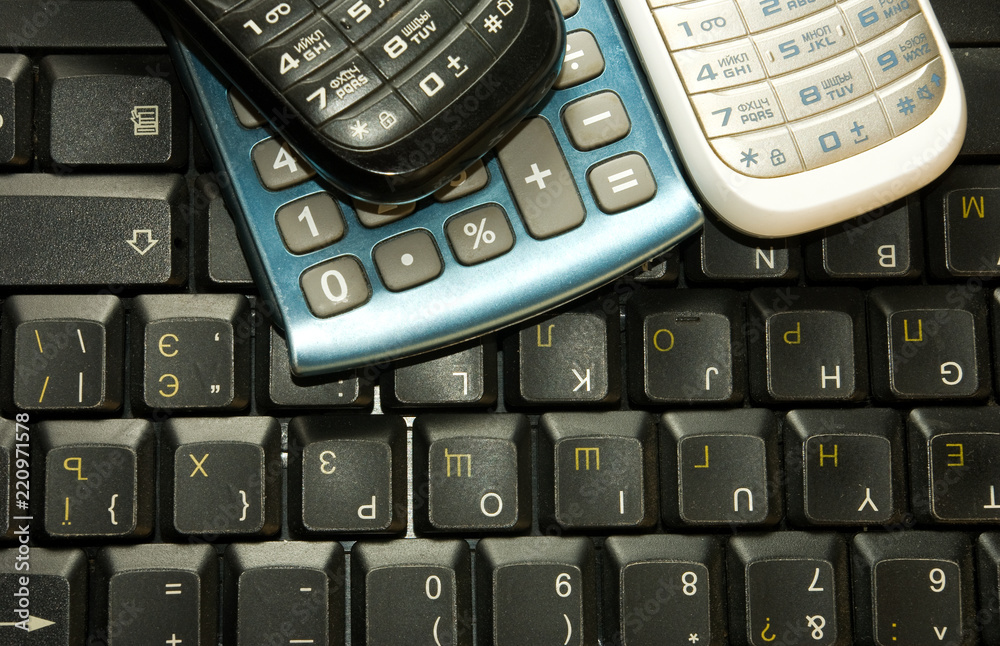 image of mobile phones and keyboard close-up