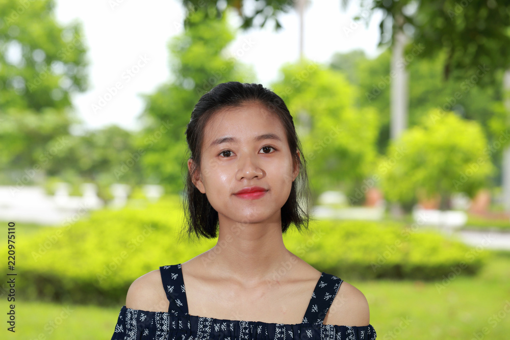 the face of young woman in bright background the face of young woman in bright background