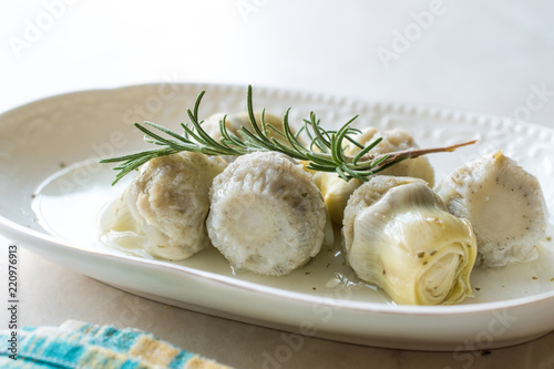Pickled Artichoke Hearts with Rosemary Marinated in Plate.