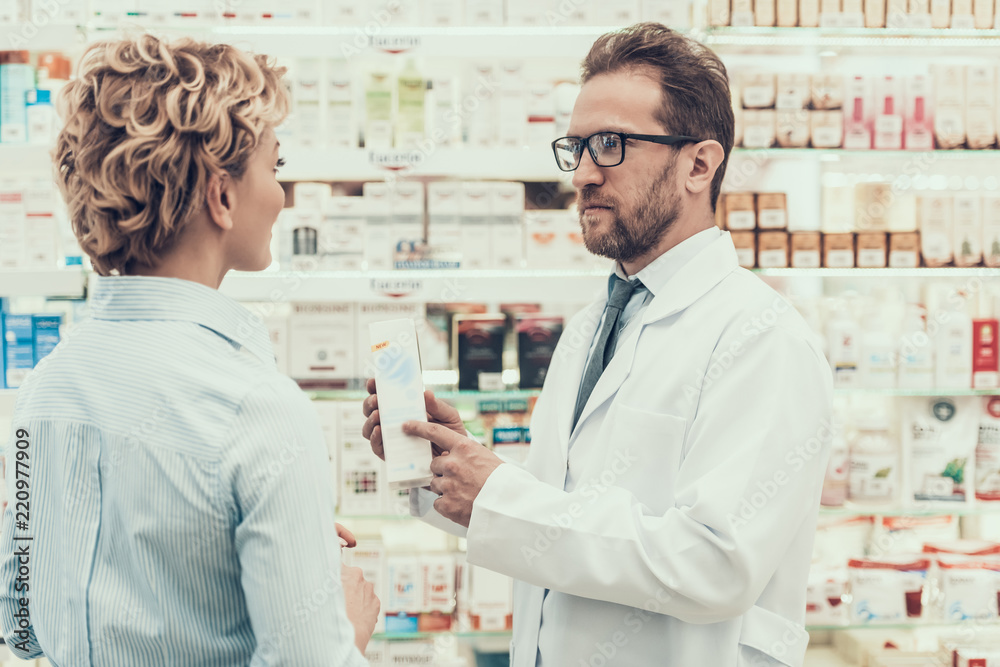 Pharmacist counseling Female Customer in Drugstore Pharmacist counseling Female Customer in Drugstore