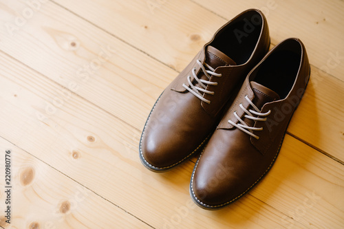 Closeup of elegant stylish brown male shoes. Preparation for wed