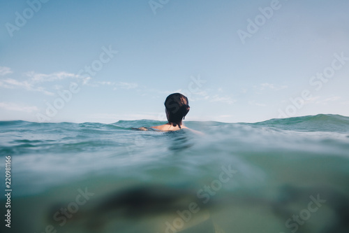 Lonely and desperate woman looking into deep waters