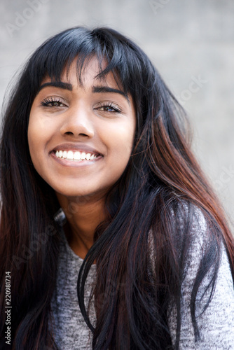 Close up smiling young Indian woman © mimagephotos