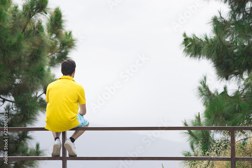 Man giving back and looking horizon