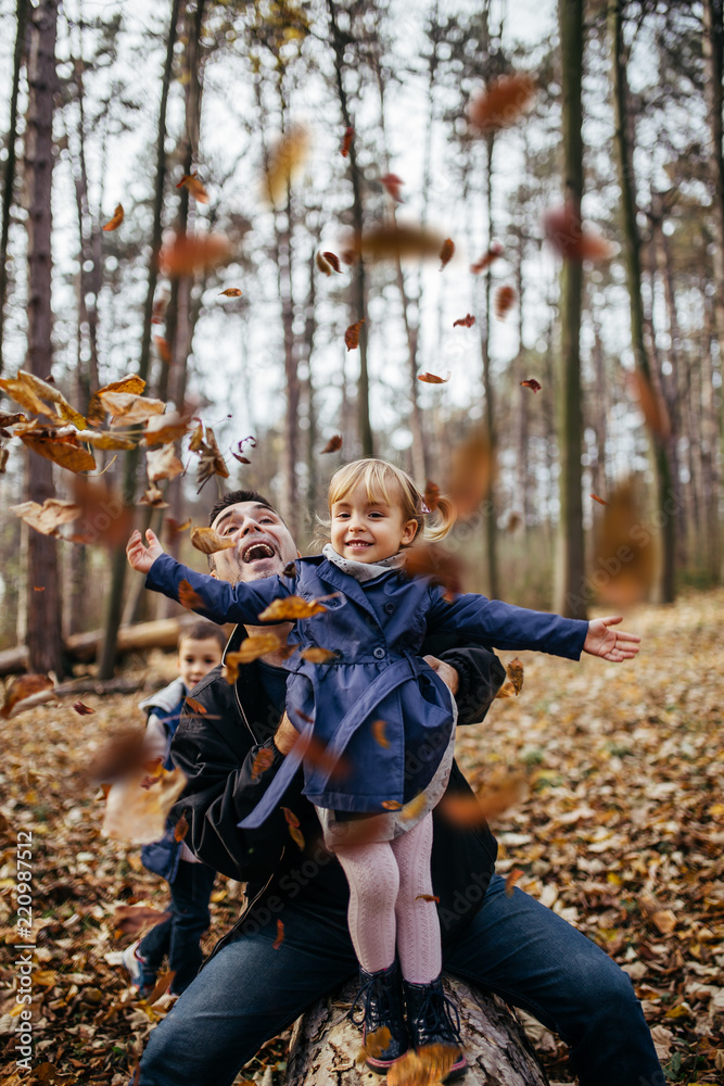 Happy young father with his doughter enjoying in autumn park. Happy young father with his doughter enjoying in autumn park.