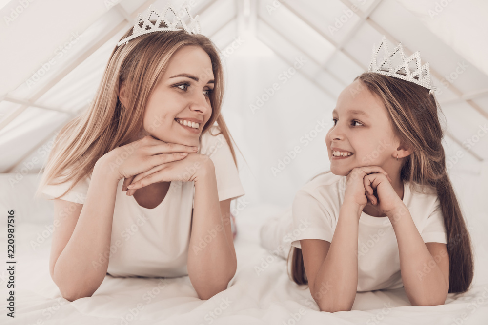 Young Mother and Little Doughter wearing Tiaras Young Mother and Little Doughter wearing Tiaras