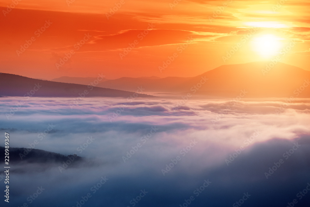Colorful landscape in mountains with fog and sun Colorful landscape in mountains with fog and sun