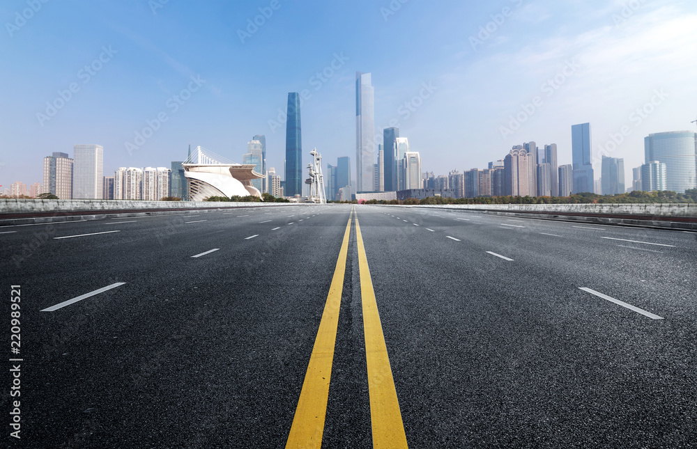 Empty road floor surface with modern city landmark buildings of guangzhou bund Skyline