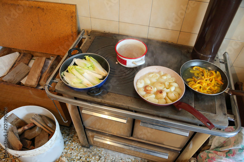 many pots on the wood burning stove photo