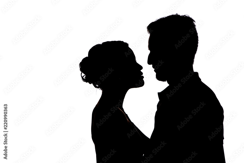 Couple silhouettes of kissing people