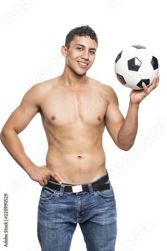 Muscular man with soccer ball