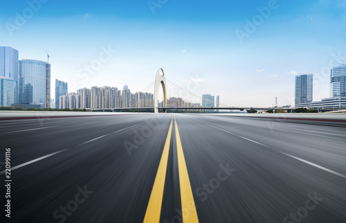 Empty road floor surface with modern city landmark buildings of guangzhou bund Skyline