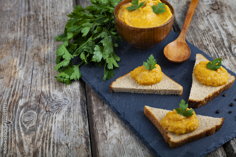 Cabbage caviar in a wooden bowl and bruschetta Cabbage caviar in a wooden bowl and bruschetta
