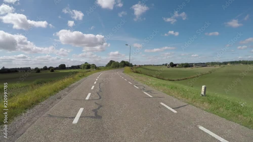 POV driving on polder dike near river Rhine in Holland between Amerongen and Wijk bij Duurstede backwards view POV driving on polder dike near river Rhine in Holland between Amerongen and Wijk bij Duurstede backwards view