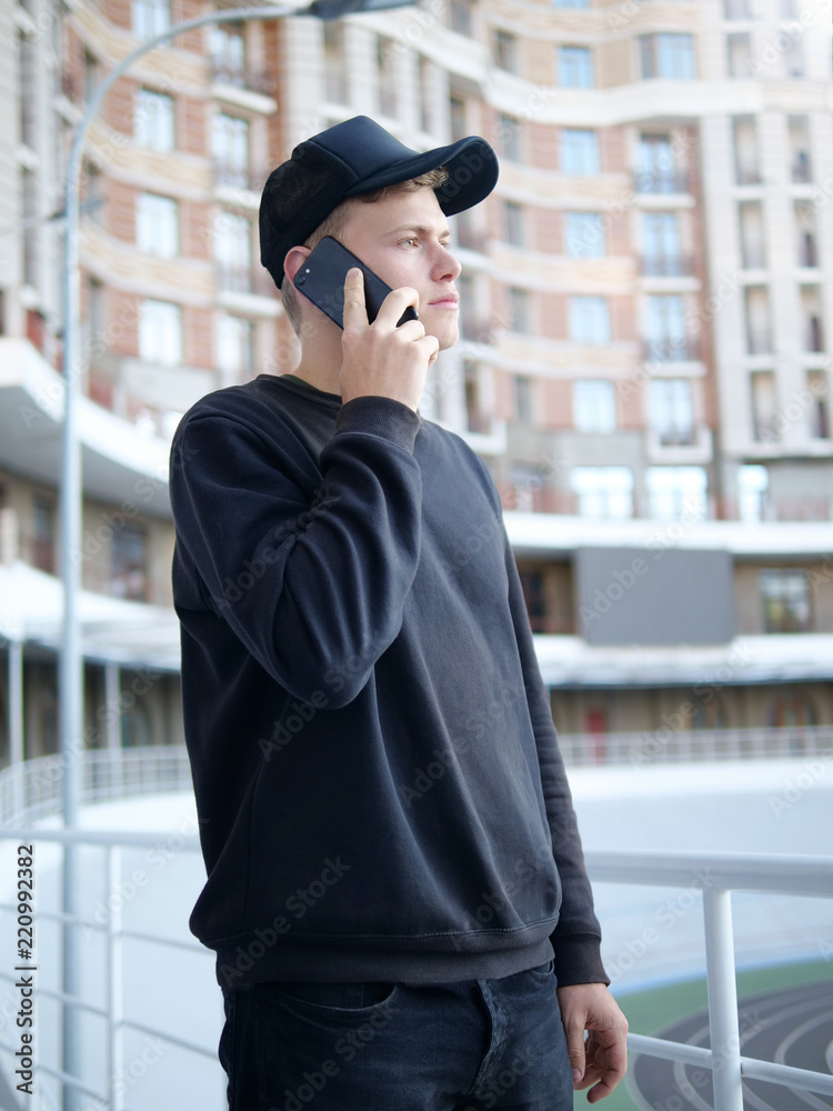 Young man talking on the phone Young man talking on the phone