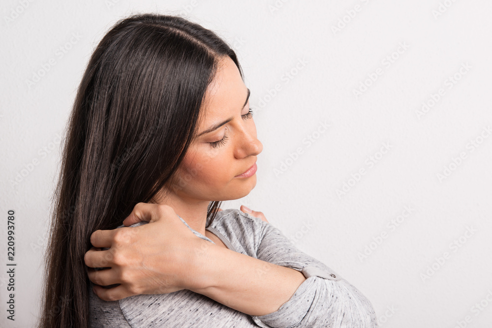 Portrait of a young beautiful woman with closed eyes in studio. Portrait of a young beautiful woman with closed eyes in studio.