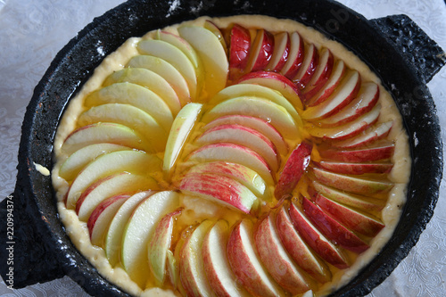 appetizing raw apple pie with a honey. Cloze ap photo