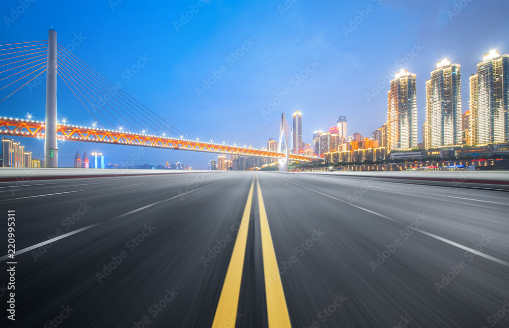 The expressway and the modern city skyline are in Chongqin.g, China