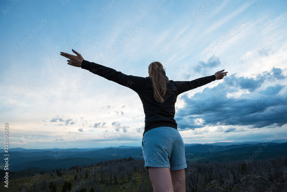 Travel, lesure and freedom concept - woman on the top of Altai mountain, beauty summer evening landcape Travel, lesure and freedom concept - woman on the top of Altai mountain, beauty summer evening landcape