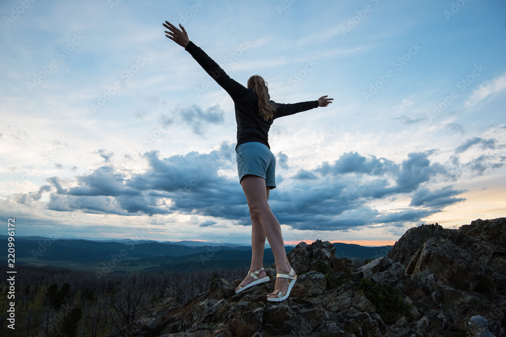 Travel, lesure and freedom concept - woman on the top of Altai mountain, beauty summer evening landcape Travel, lesure and freedom concept - woman on the top of Altai mountain, beauty summer evening landcape