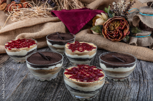 A dessert mug called magnolia made with strawbwerry , pudding and chocolate. photo