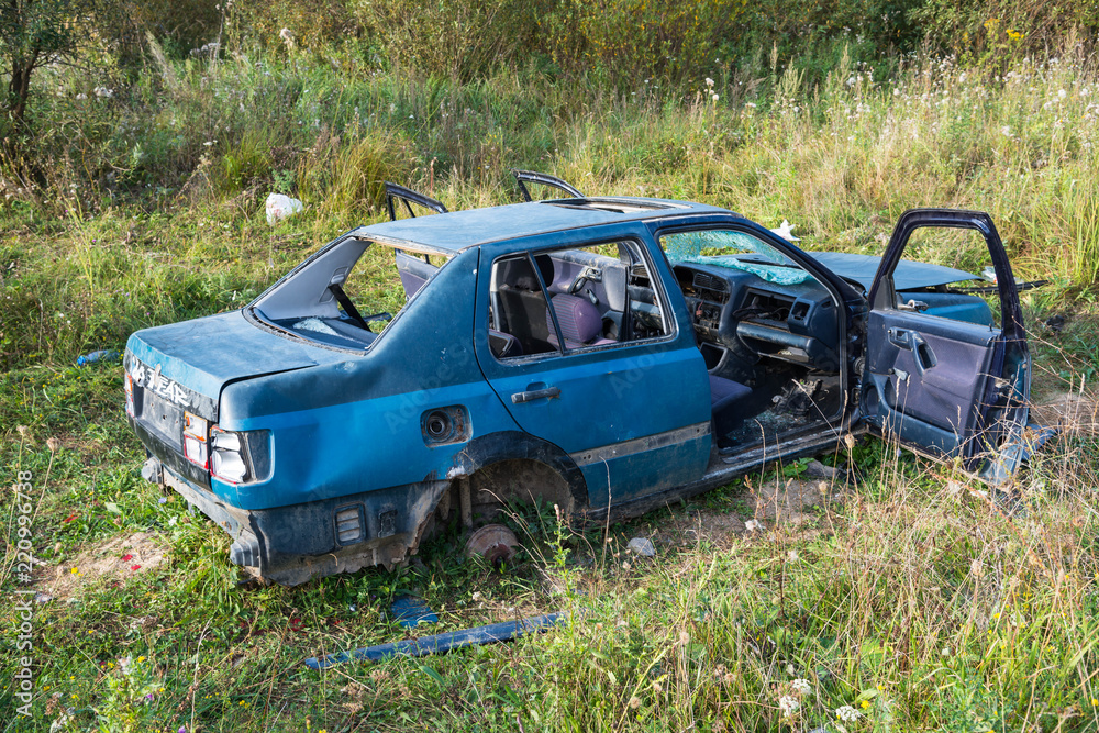 Abandoned old destroyed car close up shot. Abandoned old destroyed car close up shot.
