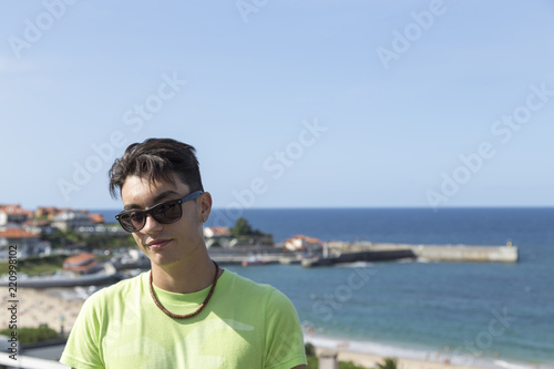 portrait of a boy in summer off the coast of Comillas, Cantabria, Spain