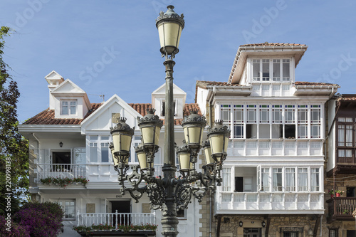 Lamppost of many tulips in a street of Comillas in Cantabria, Spain