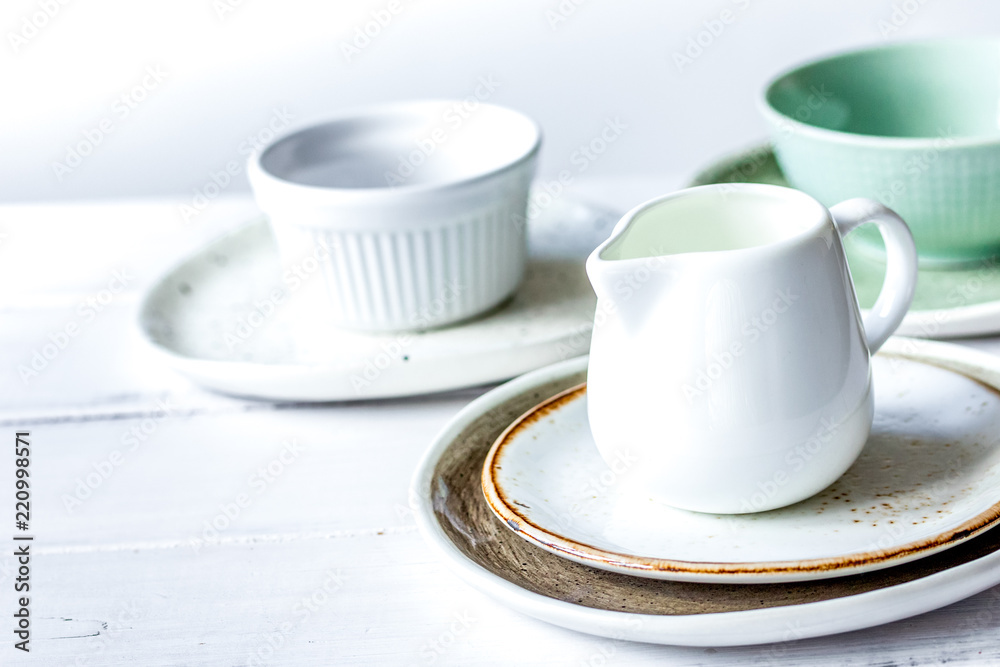 ceramic tableware with flowers on white background ceramic tableware with flowers on white background