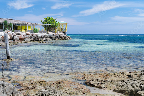Fototapeta Naklejka Na Ścianę i Meble -  Ocean view and a restaurant on the coastline in Trelawny Parish, Jamaica.
