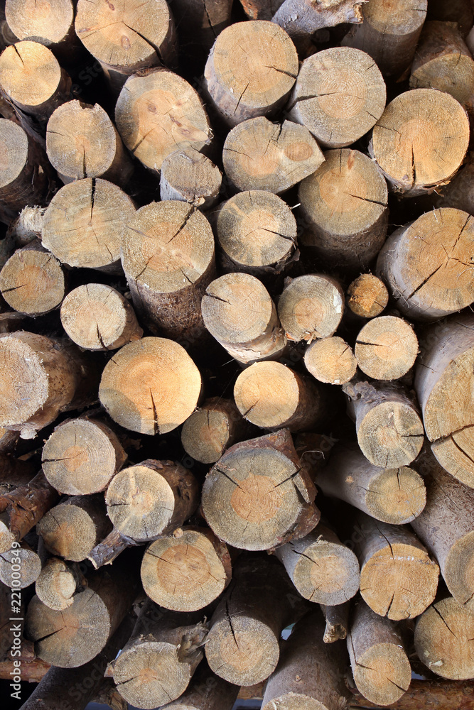 Background of firewood. Wooden background. Folded firewood Background of firewood. Wooden background. Folded firewood