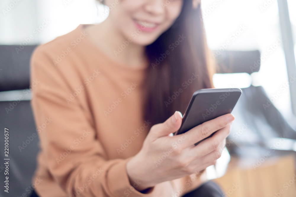 Close up woman hand holding mobile phone, She using in mobile applications and multimedia programs. copy space Close up woman hand holding mobile phone, She using in mobile applications and multimedia programs. copy space