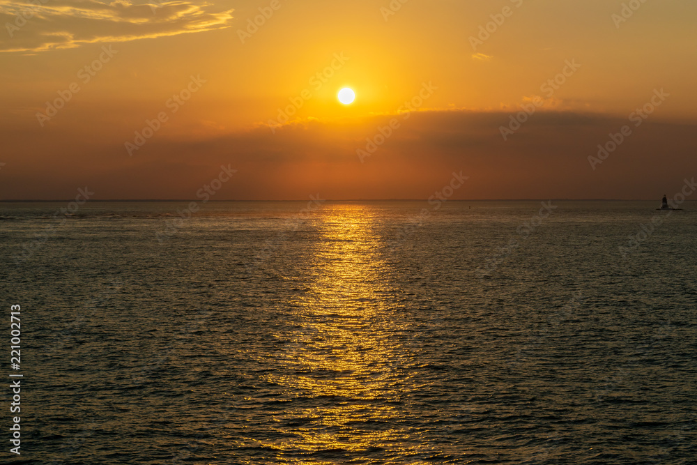 Orange skies at sunset over the Hudson River in New York City. Copy Space for Text.